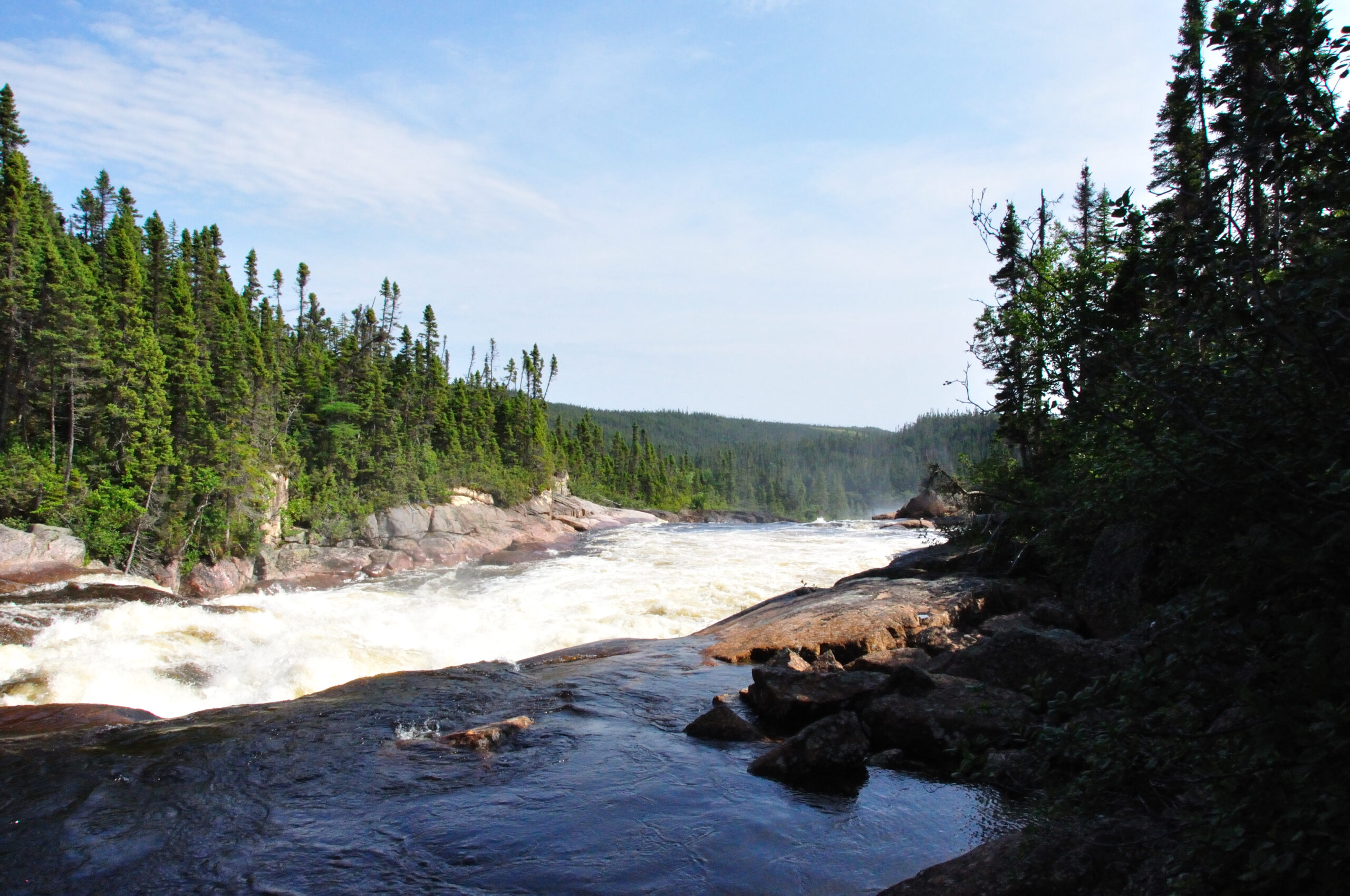 The Romaine river flowing through a forest, near Havre-St-Pierre, Quebec.